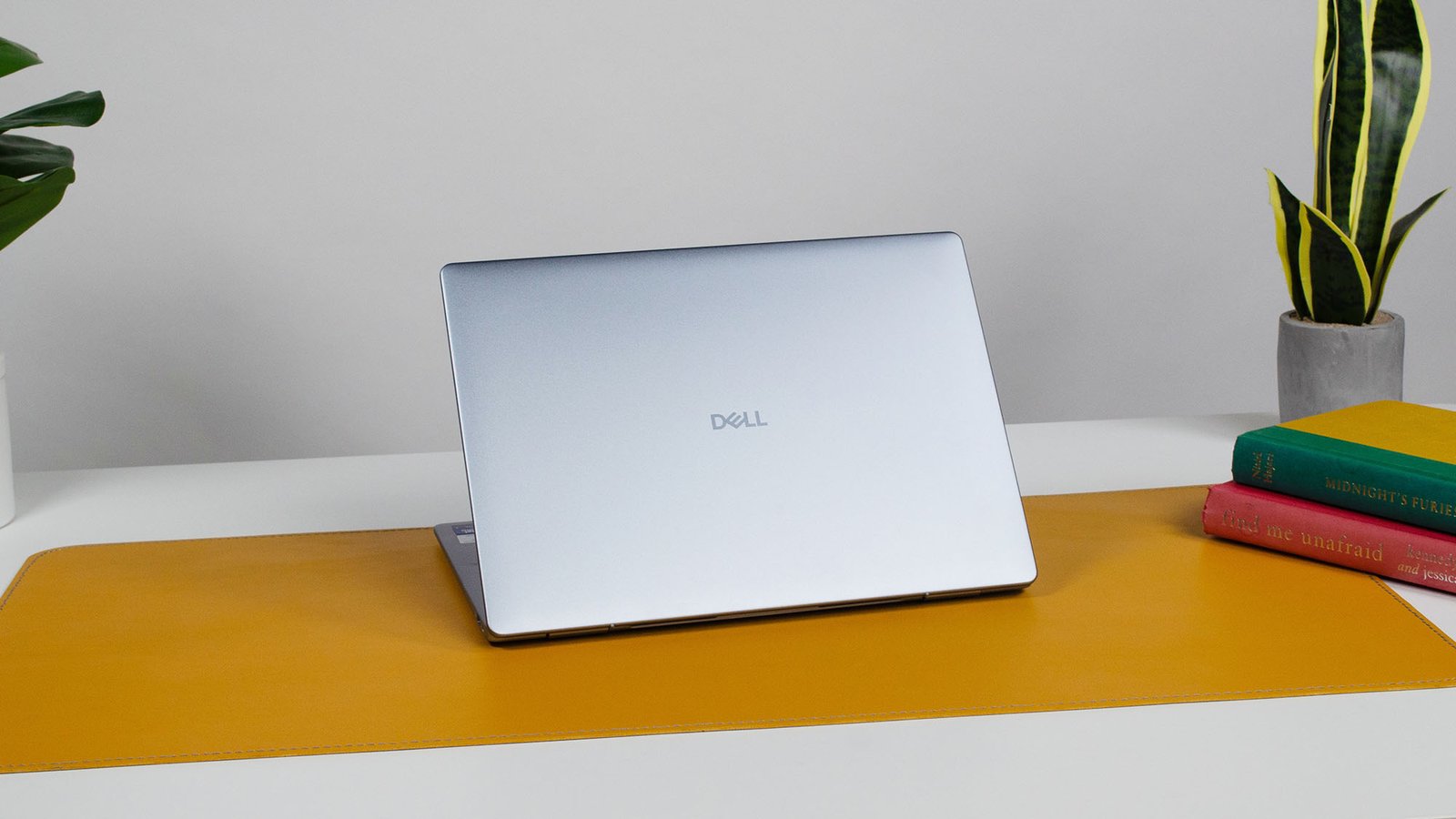 A Dell 14 Plus on a desk with its lid facing outward